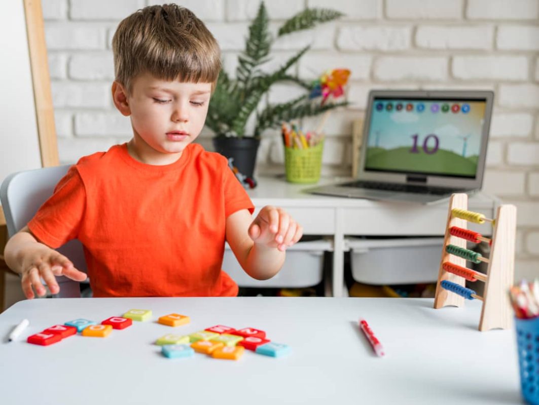 Child playing with Lego back-to-school toy