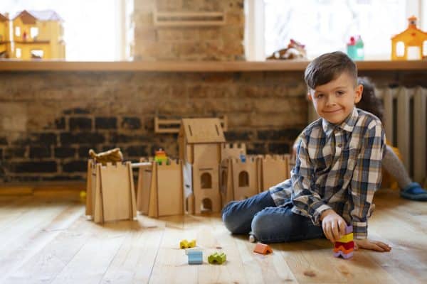 child building blocks developing independent play habits with educational toys