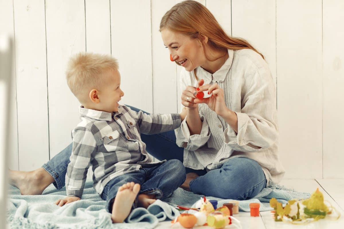 mother wondering is my child developing normally while watching toddler play