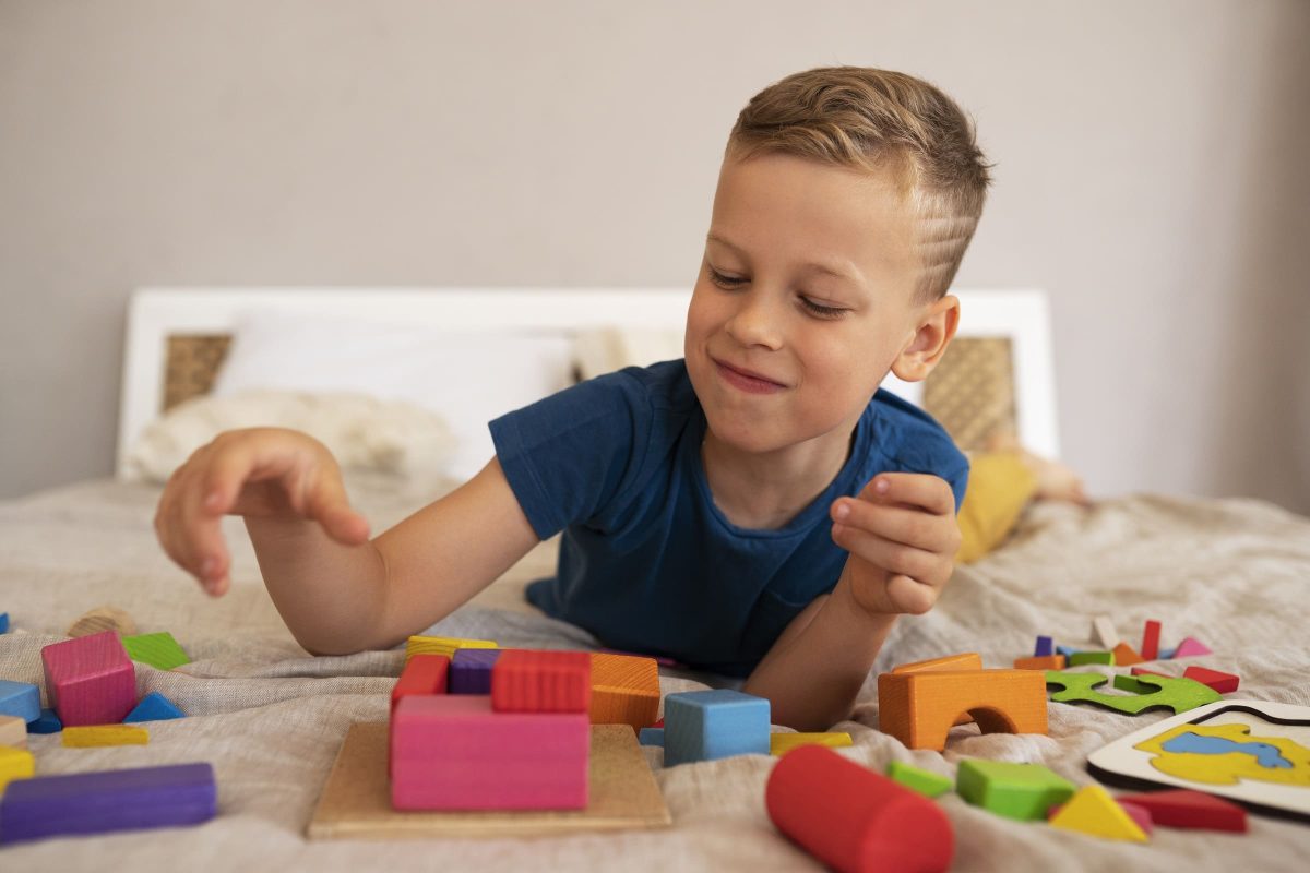Toddler playing with screen-free wooden educational toys at home
