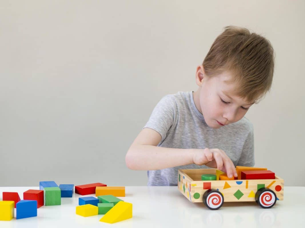 child improving problem solving skills through educational toys
